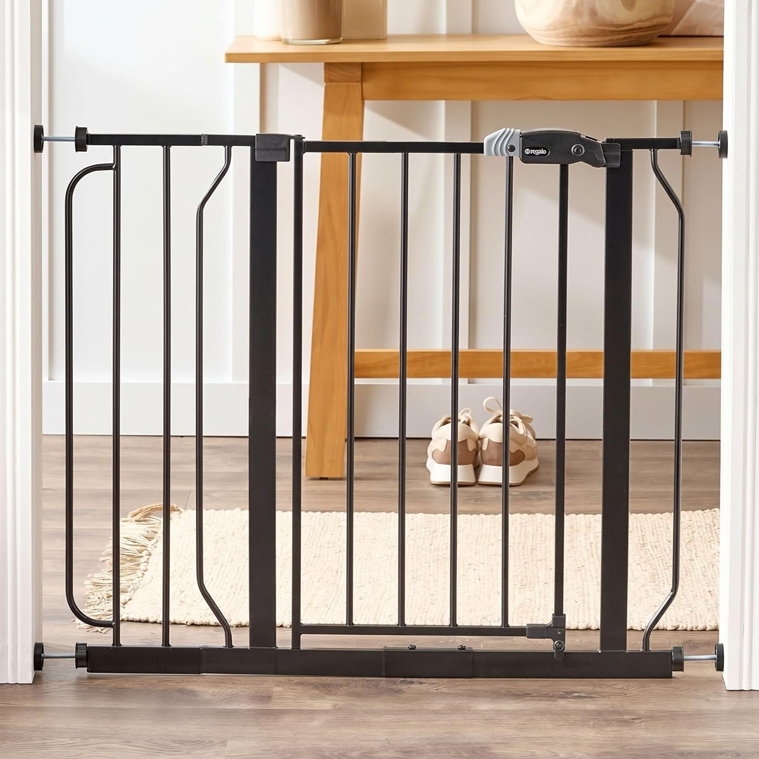 Regalo Safety 29″-38.5″ Easy Step Baby Gate, Bottom of Stairs & Doorways | Pressure Mounted with Door, For Babies, Toddlers & Pets, Black, Tested & Trusted for 30 Years